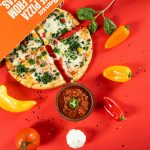 Pizza sobre mesa, imagen ilustrativa sobre la inspiración del turrón de pizza Margarita de Dabiz Muñoz